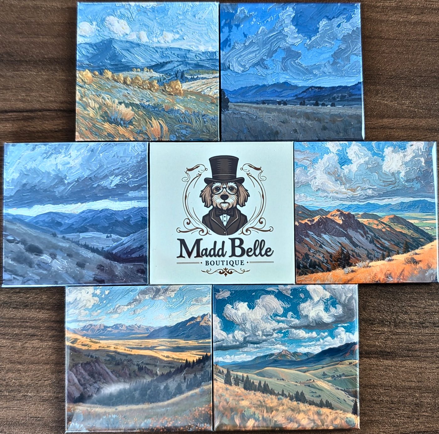 Madd Belle Boutique State Series ceramic magnets arranged on wood
